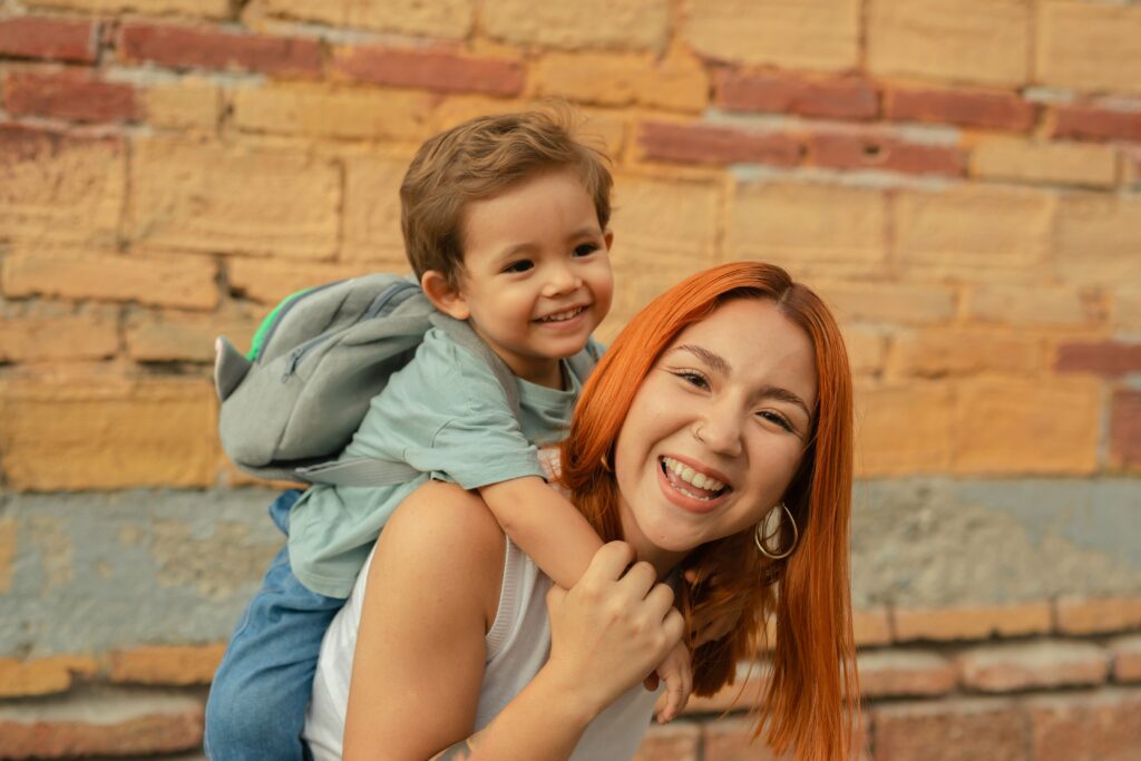 Nanny and boy, piggyback